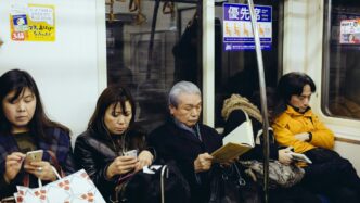 five person sitting inside train
