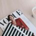 white capped pen on top of Vogue magazine beside cup of coffee
