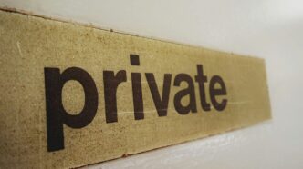 a wooden sign that says private on it