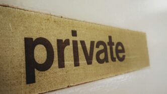 a wooden sign that says private on it