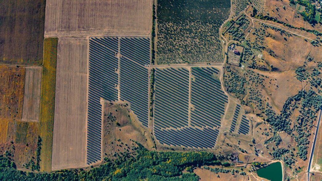 Aerial view of a large solar panel farm.