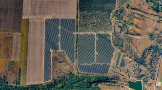 Aerial view of a large solar panel farm.