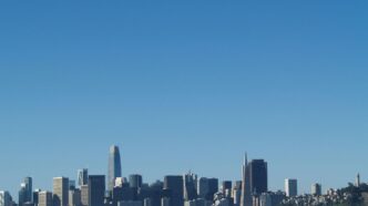 city skyline under blue sky during daytime