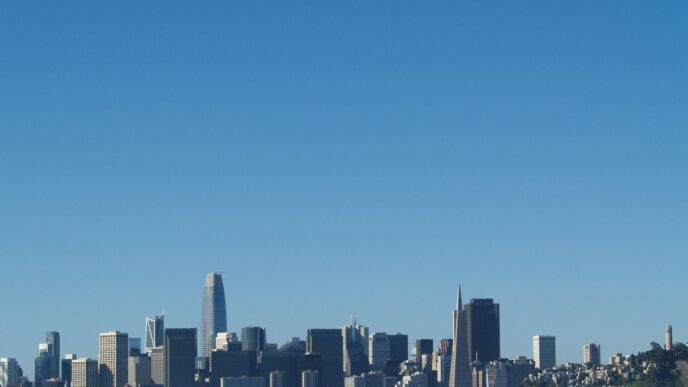 city skyline under blue sky during daytime