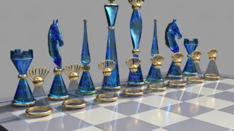 a chess board with blue glass pieces on it