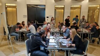 a group of people sitting around a table