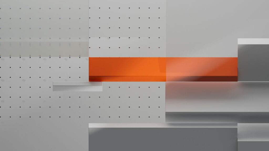 An abstract photo of a white and orange wall