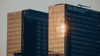 A couple of tall buildings sitting next to each other