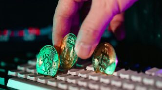 A person is typing on a computer keyboard