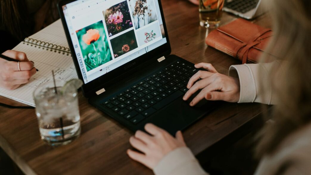 woman using black laptop computer