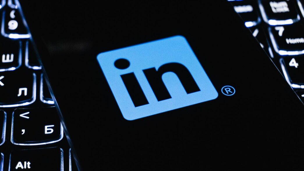 Linkedin logo on a dark illuminated keyboard