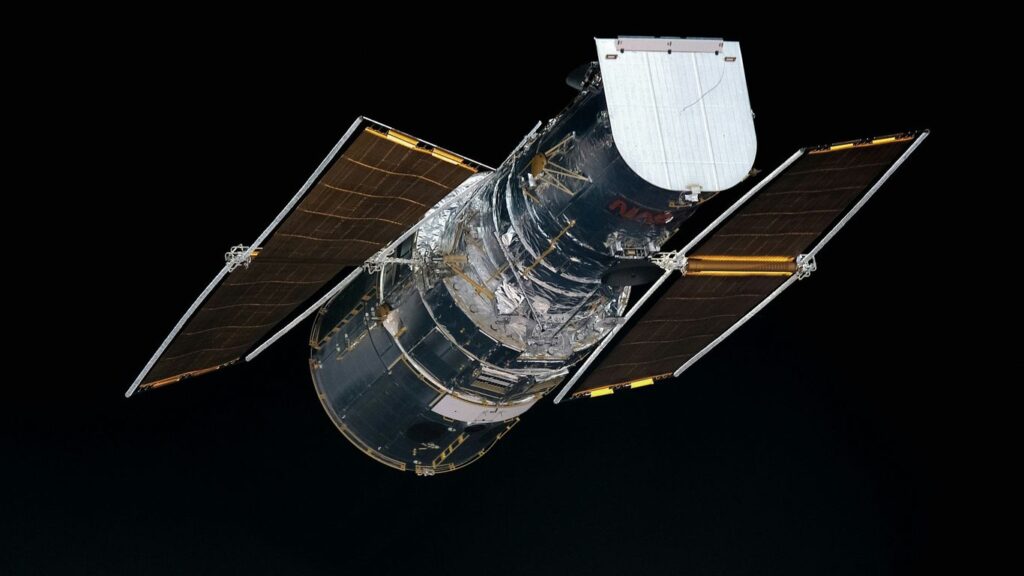 a satellite in the dark with a black background