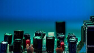 Circuit board filled with electronic components.