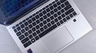 an open laptop computer sitting on top of a table