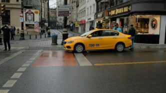 yellow car on road during daytime