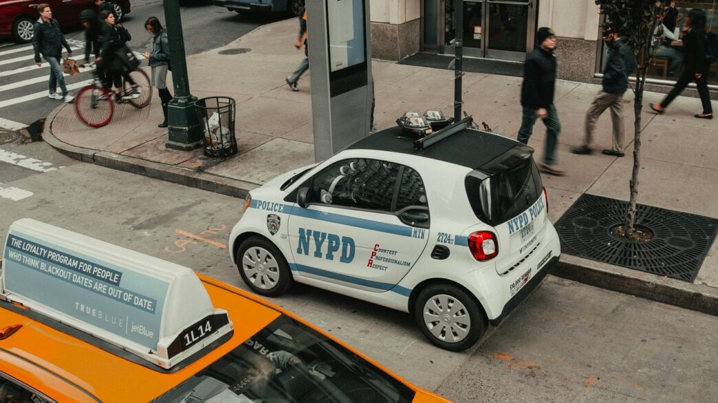 white and yellow sedan on road during daytime