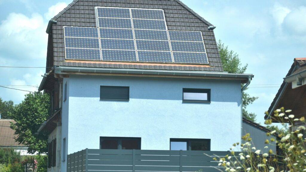 A house with a solar panel on the roof