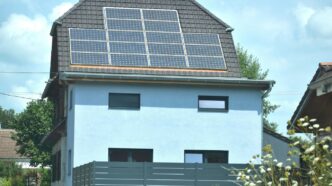 A house with a solar panel on the roof