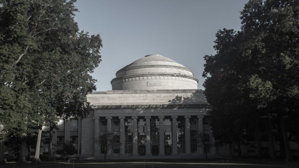 a black and white photo of a building with a dome