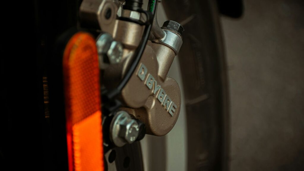 orange and silver bicycle wheel