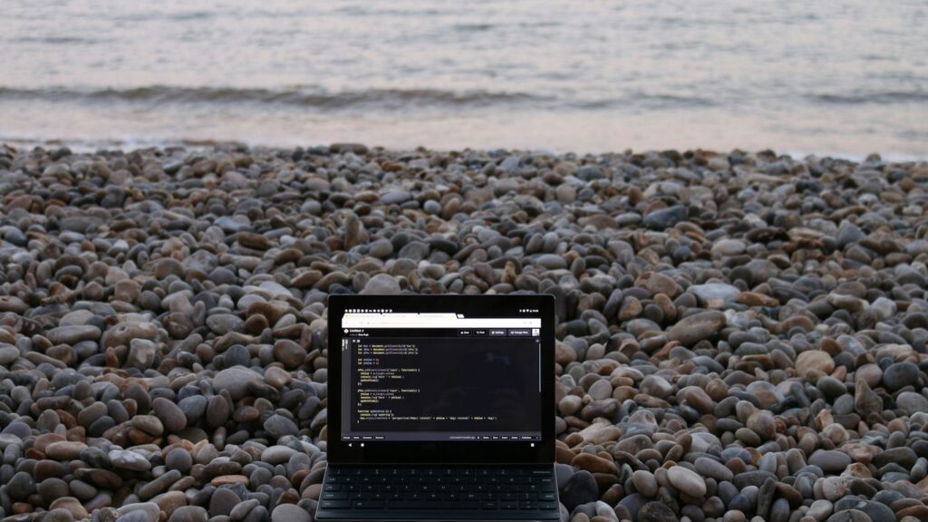 a tablet on a rocky beach
