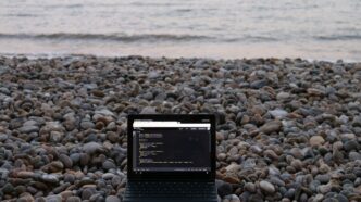 a tablet on a rocky beach