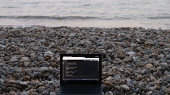 a tablet on a rocky beach