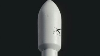 a close up of a white rocket on a black background