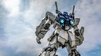 Giant white robot with blue glowing eyes against sky