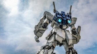 Giant white robot with blue glowing eyes against sky