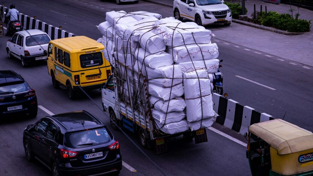a truck with a load of bags on the back of it