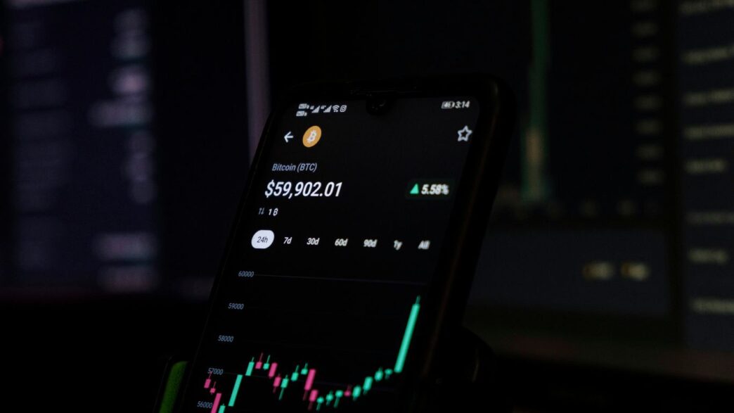 a cell phone displaying a stock chart on the screen