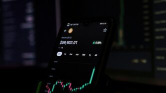 a cell phone displaying a stock chart on the screen