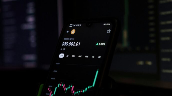 a cell phone displaying a stock chart on the screen