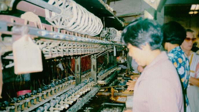 A group of people standing in front of a machine