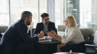 a group of people sitting around a table