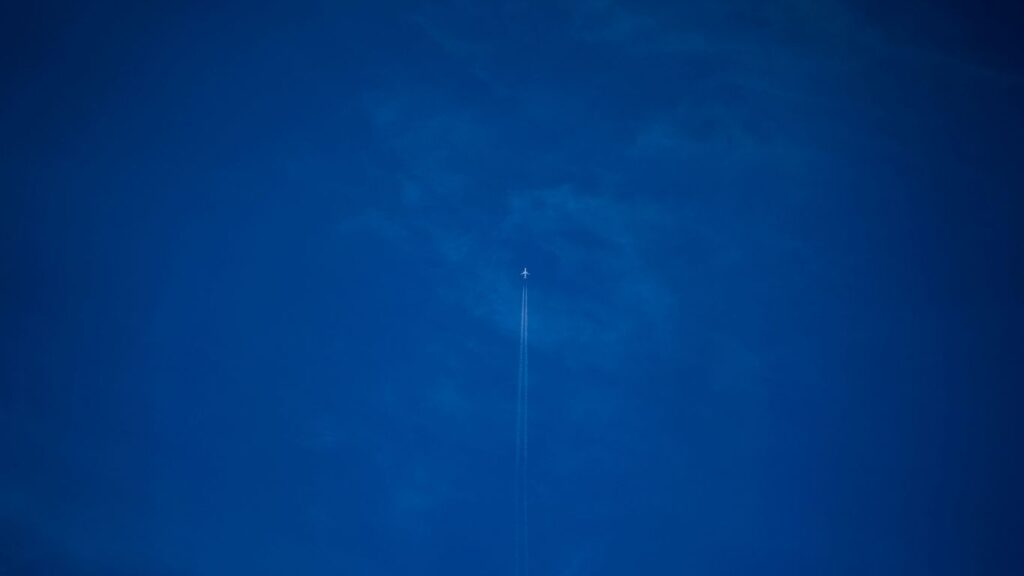 white light bulb on blue sky