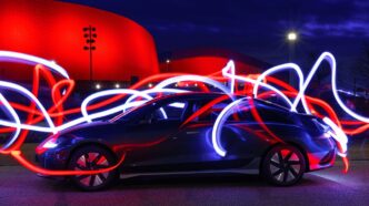 a car parked in front of a red building