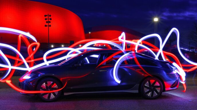 a car parked in front of a red building