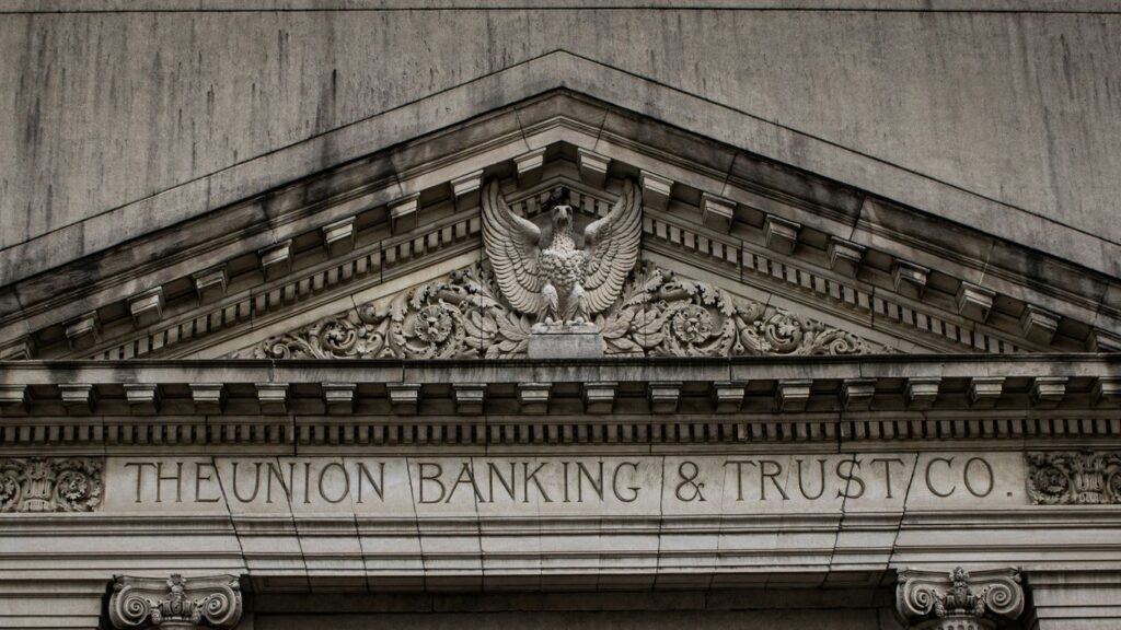 brown concrete building with statue