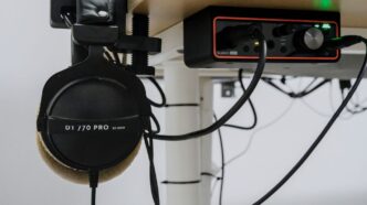 Headphones and audio interface on a desk