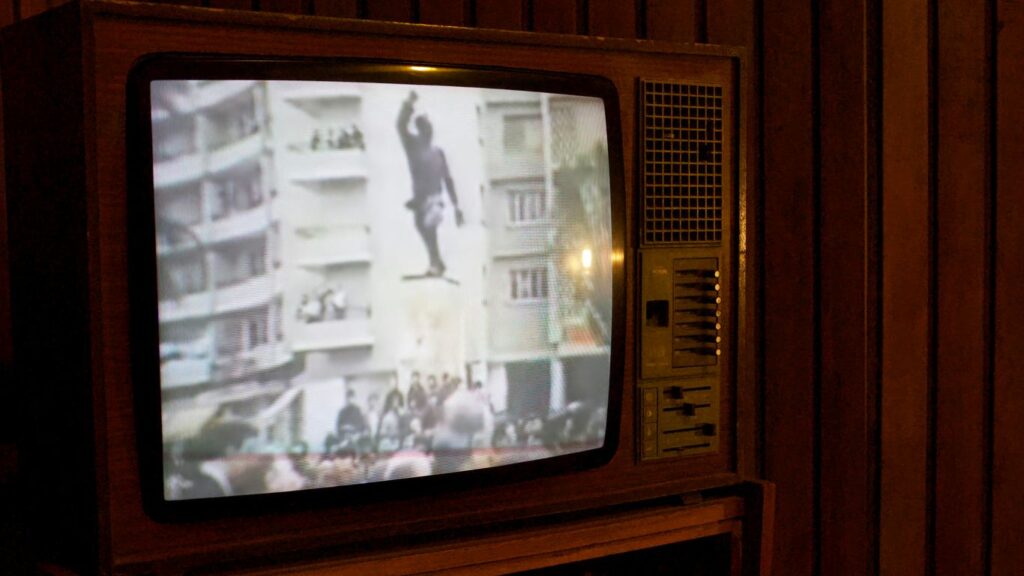 a television with a picture of a man on it