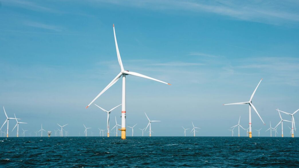 a group of wind turbines in the ocean