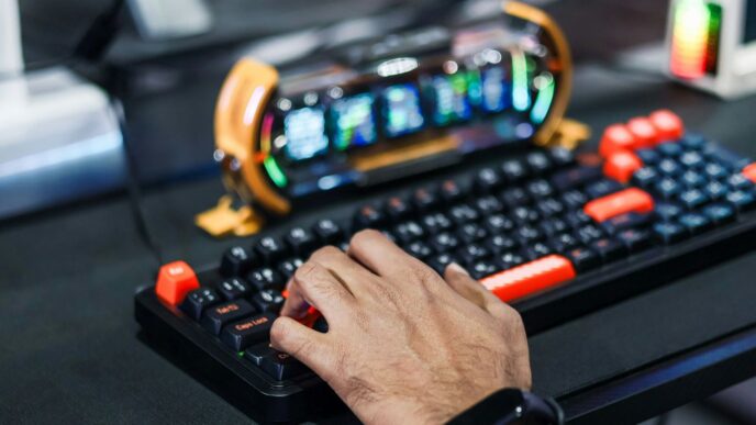 Person's hand typing on a gaming keyboard