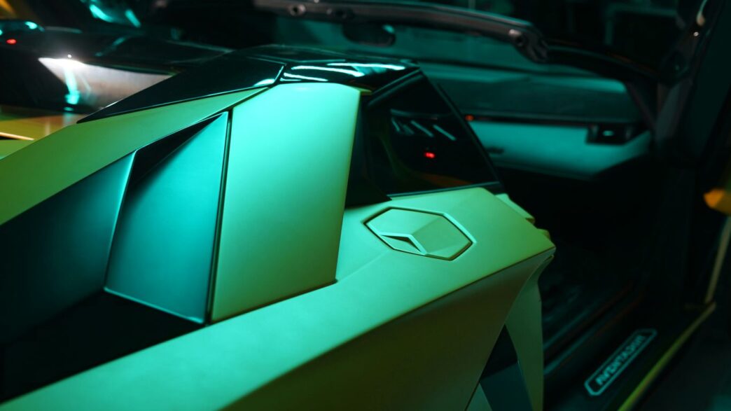 The interior of a car with a green and black interior