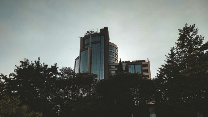 a tall building with trees in front of it