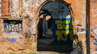 Graffiti-covered brick arches of an abandoned building