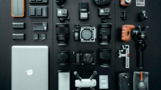 silver MacBook beside battery charger