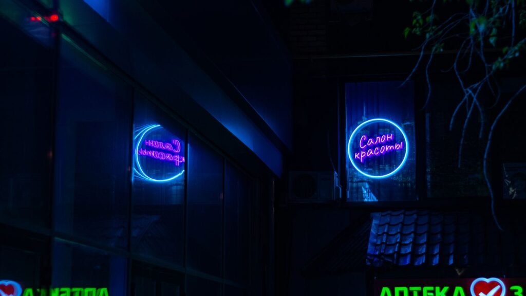 a building that has a neon sign on it