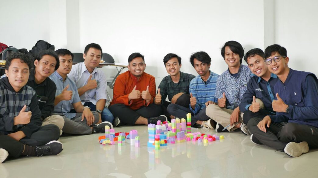 a group of men sitting next to each other